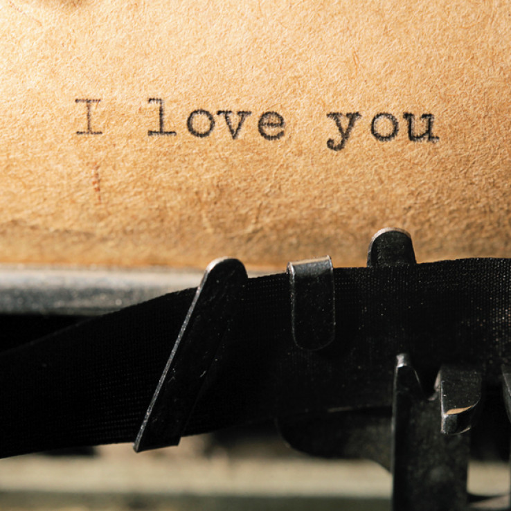 love is, the inscription on a typewriter